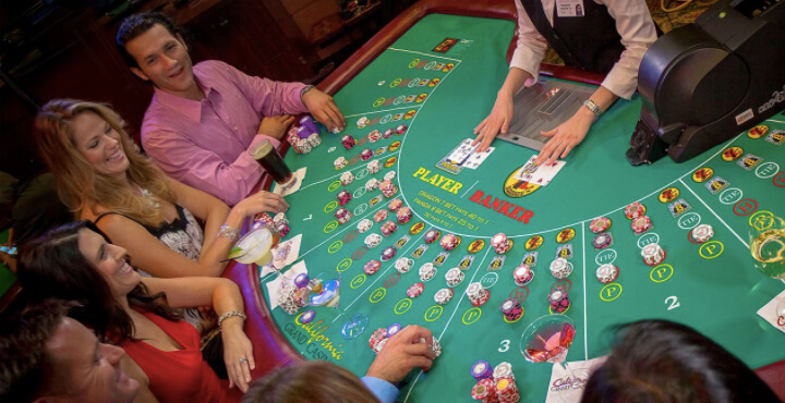 Baccarat players playing