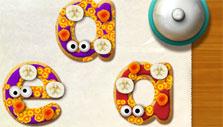 Decorating my letter cookies in Alphabet Kitchen